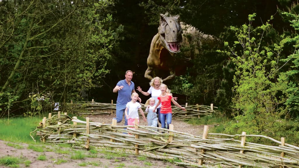 Family running away from a dinosaur