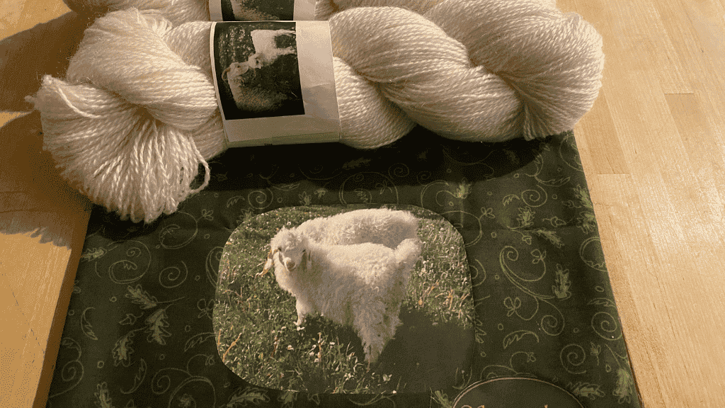 White mohair yarn lying on the table