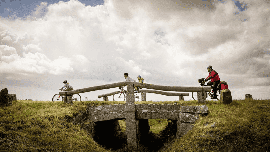 Immervad Stone Bridge with three cyclists